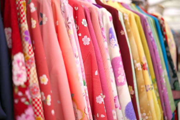 Closeup of kimonos on hangers Tokyo,Japan-January 6, 2019: Closeup of kimonos on hangers kimono photos stock pictures, royalty-free photos & images