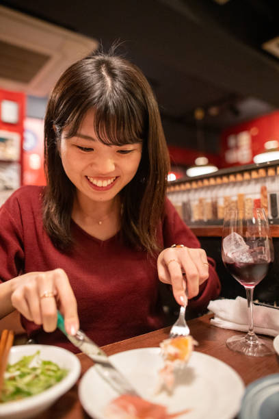 istock Young woman eating differ at Italian restaurant 1197941219