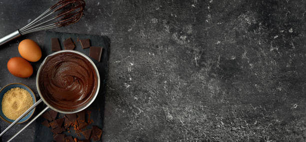 istock Top view of pot with hot chocolate on dark background 1197948101