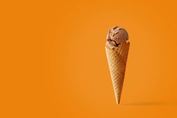 istock Ice cream cone with caramel flavors on a pink background 1197948149