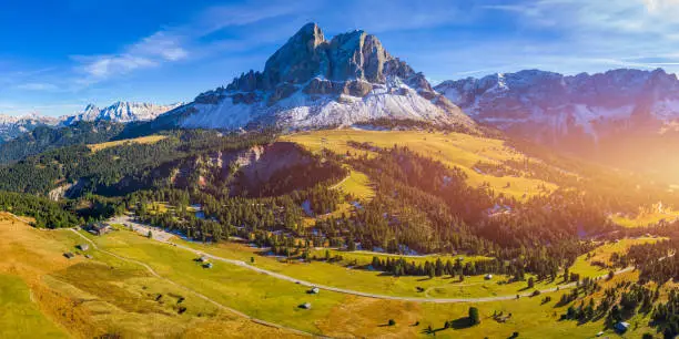 Stunning view of Peitlerkofel mountain from Passo delle Erbe in Dolomites, Italy. View of Sass de Putia (Peitlerkofel) at Passo delle Erbe, with wooden farm houses, Dolomites, South Tyrol, Italy.