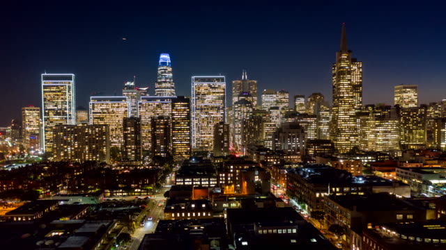 San Francisco Aerial v79 Dusk to night hyperlapse following paths of Front & Battery streets from Financial District toward Embarcadero 12/18