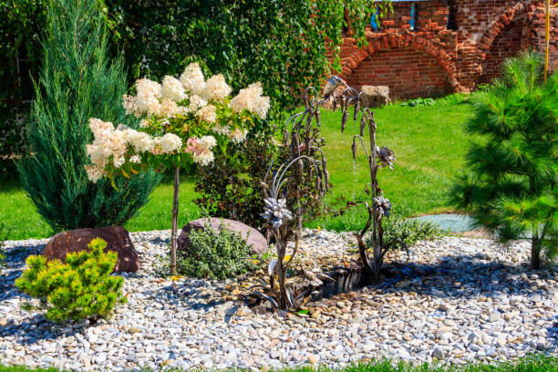 Arch shaped forged iron fountain in a garden
