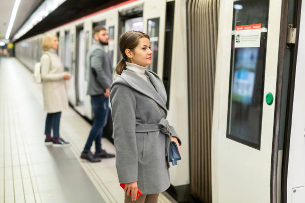 istock Female waiting for train on subway platform 1197954944