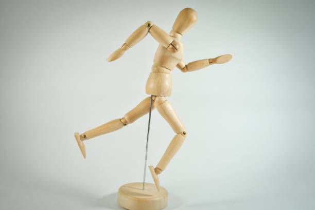 istock The wooden human figure running post on white background 1197974715