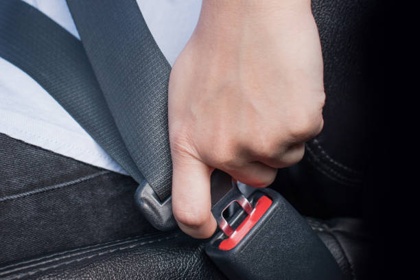istock Man fastening seat belt in car. transportation concept. 1197976456