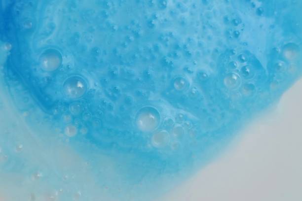 istock blue soap macro background.soap bubbles blue pastel color with a white gradient. Detergent texture. Shower gel. Purity and freshness. Bath foam. Ease.Lightness and airiness 1197984139