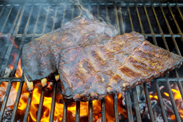 istock Spare beef ribs on BBQ grill with flame 1197985206