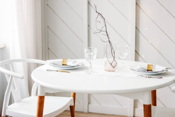 istock Festive table set for two, minimalistic Christmas decor. Scandinavian interior 1197992424