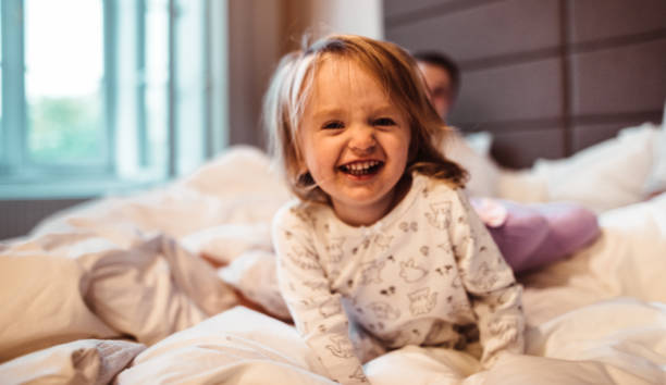 istock happy family in the bed 1197996197