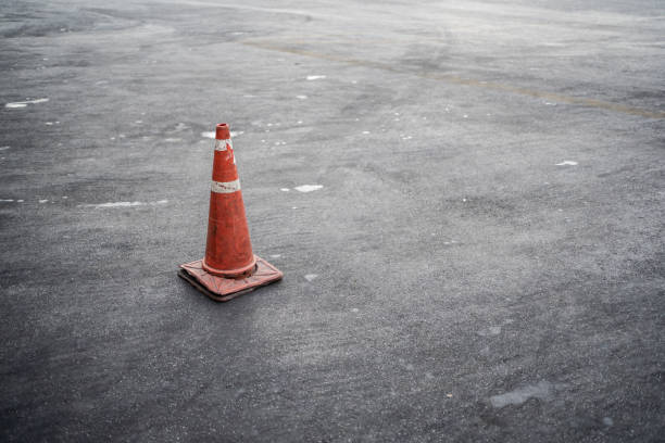 istock Orange traffic cone on the asphalt road 1197996277