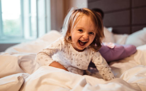 istock happy family in the bed 1197996333