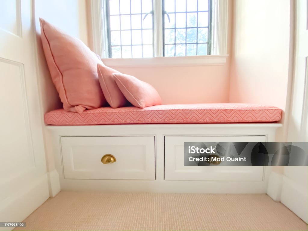 Custom Built Window Seat with Custom Cushion and Pillows Window bench seat. Storage Compartment Stock Photo