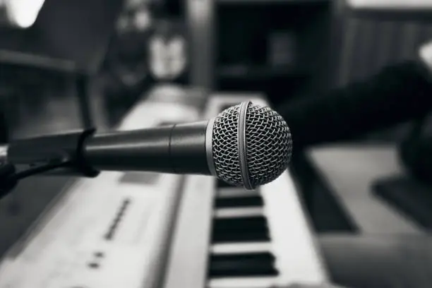 Microphone to enhance the sound of a musical instrument, black and white photo