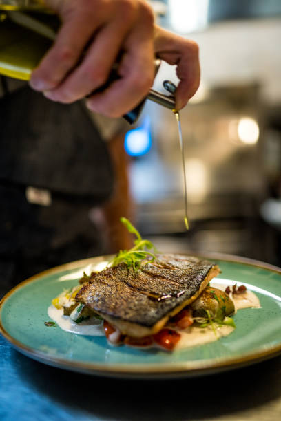 istock The cook made Grilled salmon and vegetables 1197998167