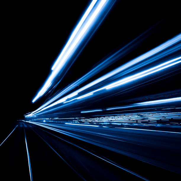 istock Abstract long exposure and blurred city lights 1197999617