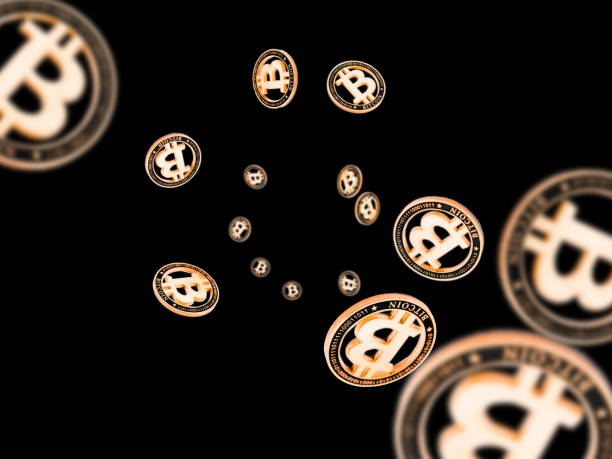 istock Cryptocurrency background. Falling Gold Bitcoin isolated on black. Falling money concept 1198007142