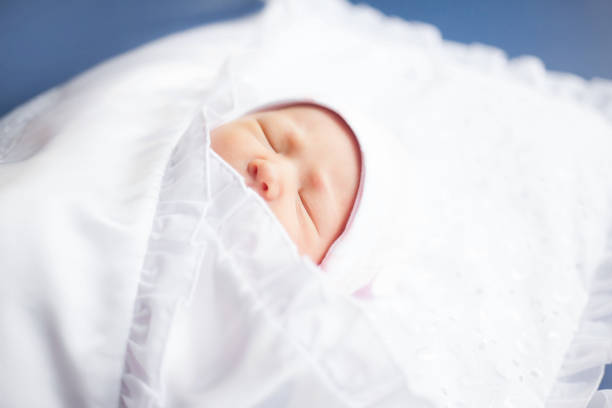 istock newborn baby wrapped in a white diaper 1198008497