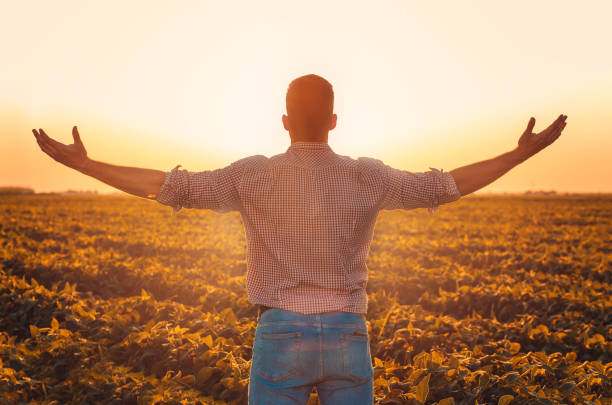 Free Stock Photo of Man Standing in Field With Hands Together ...