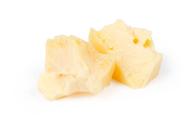 istock Two broken pieces of the hard cheese on white background 1198013505