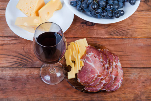 istock Red wine against the cheese, cured pork, grape, top view 1198014410