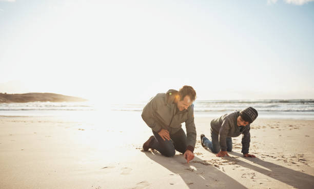 istock Let's leave a message in the sand 1198015804