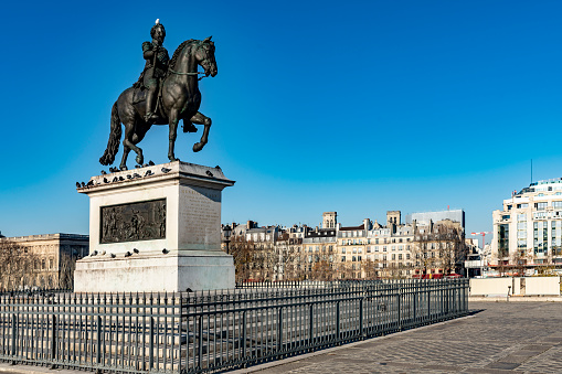 2019 The banks of the River Seine in Paris with the statue of Henrici Magni (King Henry IV) in the foreground. It was created in 1818.