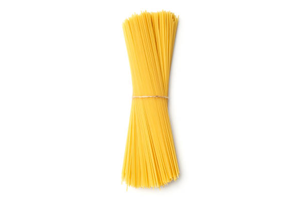 istock Spaghetti. Yellow pasta, ready for cooking. Isolated white background. Top view, flat lay 1198016574