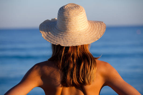 istock woman facing the sea 1198017182