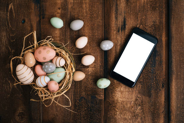 Easter decoration with smartphone Easter decoration with smartphone moses basket stock pictures, royalty-free photos & images