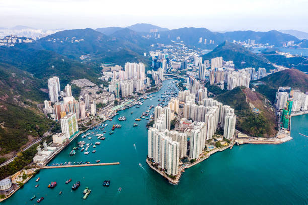 Drone view of Aberdeen, Hong Kong Aerial view of the Aberdeen Harbour (Aberdeen Typhoon Shelter) and Ap Lei Chau Bridge in Hong Kong aberdeen hong kong photos stock pictures, royalty-free photos & images