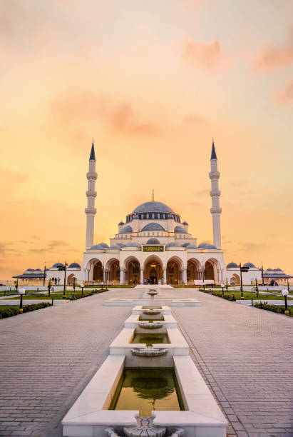 Beautiful mosque in sharjah sunset view Beautiful sunset view of Sharjah New Mosque second largest mosque in United Arab Emirates beautiful traditional Islamic architecture Design new tourist attraction in Middle east emirate of sharjah stock pictures, royalty-free photos & images