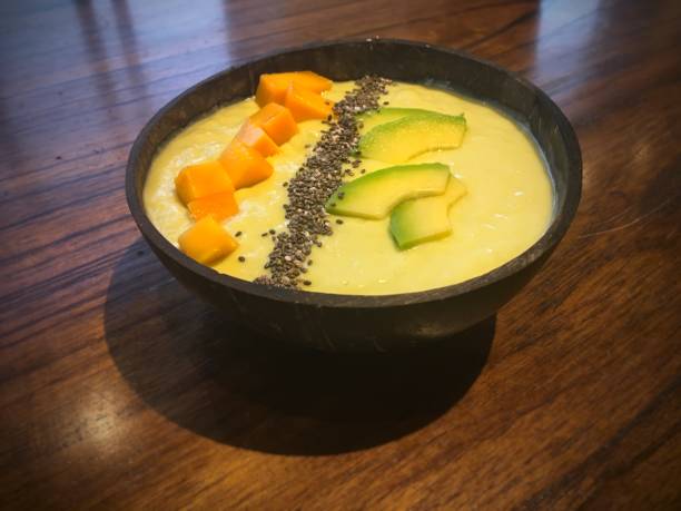 istock Vietnamese avocado desert with mango pieces served in a coconut shell 1198022859
