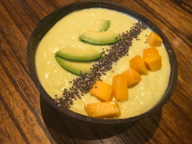 istock Vietnamese avocado desert with mango pieces served in a coconut shell 1198022871