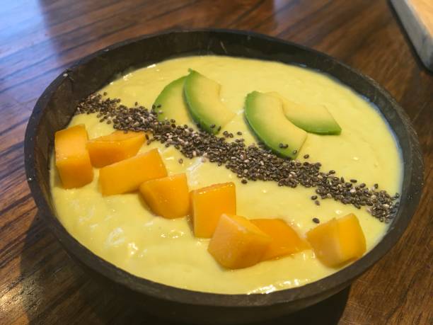 istock Vietnamese avocado desert with mango pieces served in a coconut shell 1198022882