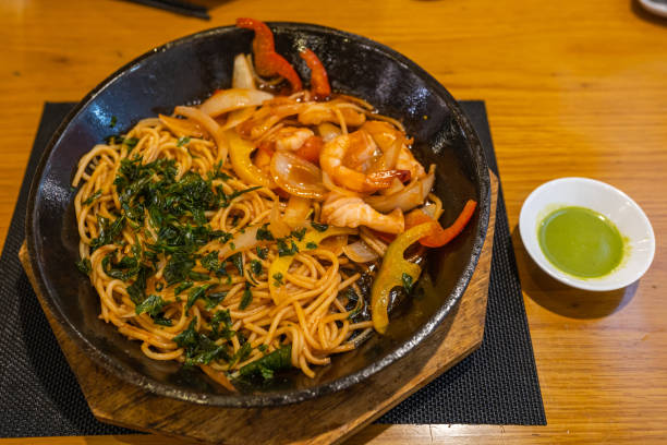 Plate of delicious seafood spaghetti served with shrimp and vegetables