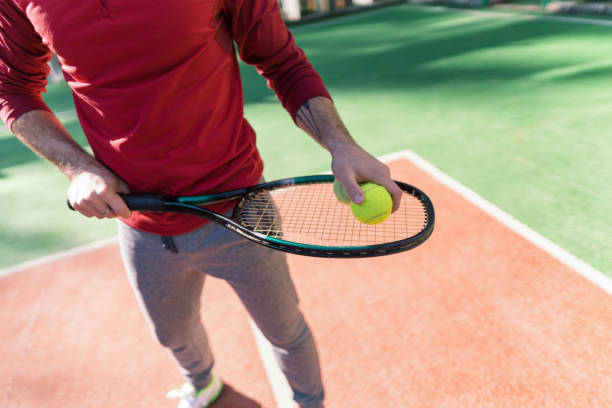 istock Tennis player preparing to serve the ball 1198024508