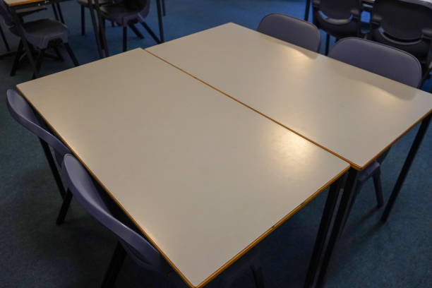 istock Classroom desks and chairs  in a classroom 1198025258