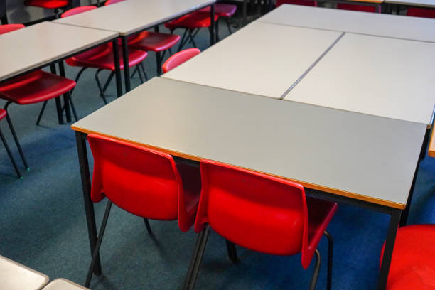 istock Classroom desks and chairs  in a classroom 1198025306