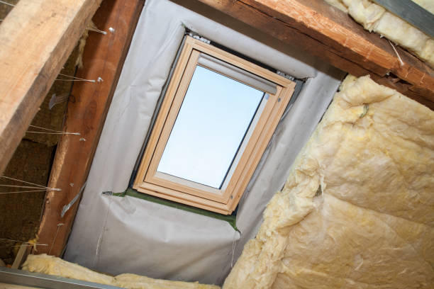 istock Prepared attic hole for roof window assembly, wool insulation for the ceiling prepared in a circle. 1198025387
