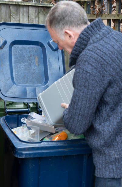 istock 2019 Senior man putting out recycling 1198025832