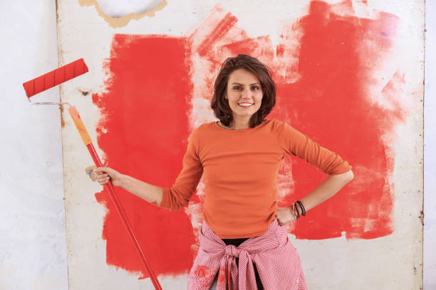 istock Woman making home improvement alone 1198028305