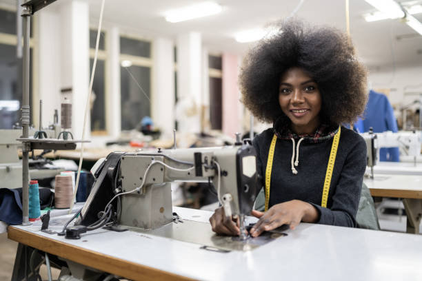 istock African worker in fashion factory using sewing machine 1198028434