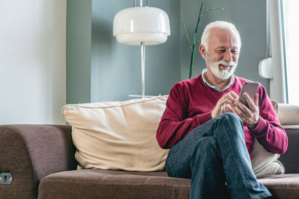 istock Portrait of senior men at home using smart phone 1198029687
