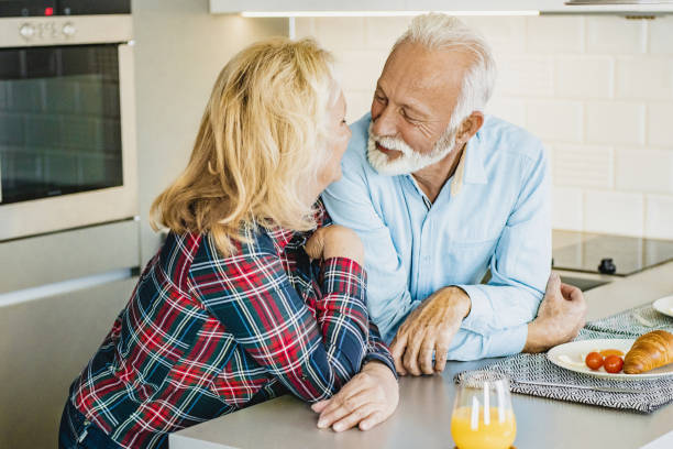 istock Senior couple having breakfast at home 1198029817