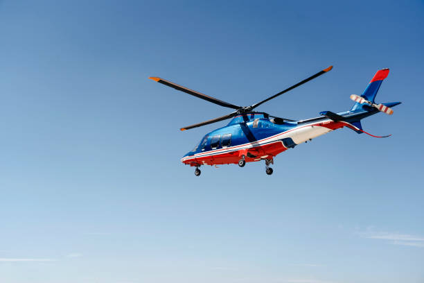 istock Solo helicopter in blue skies 1198032992