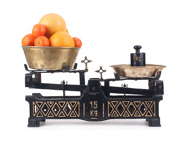istock Old-fashioned balance scale with citrus 119803434