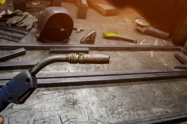 istock welding machine close-up on the background of the table 1198035006