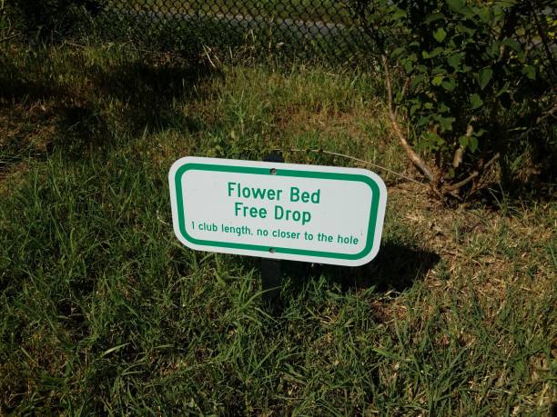 istock flower bed free drop sign on grass on golf course 1198035090