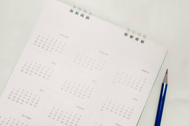 istock Blurred calendar in planning concept.White tone. 1198037344